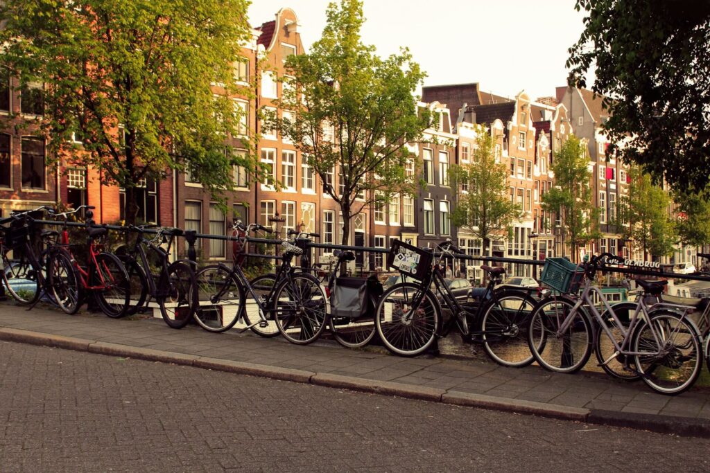 bicycles parked along the canal - Amsterdam Solo Travel