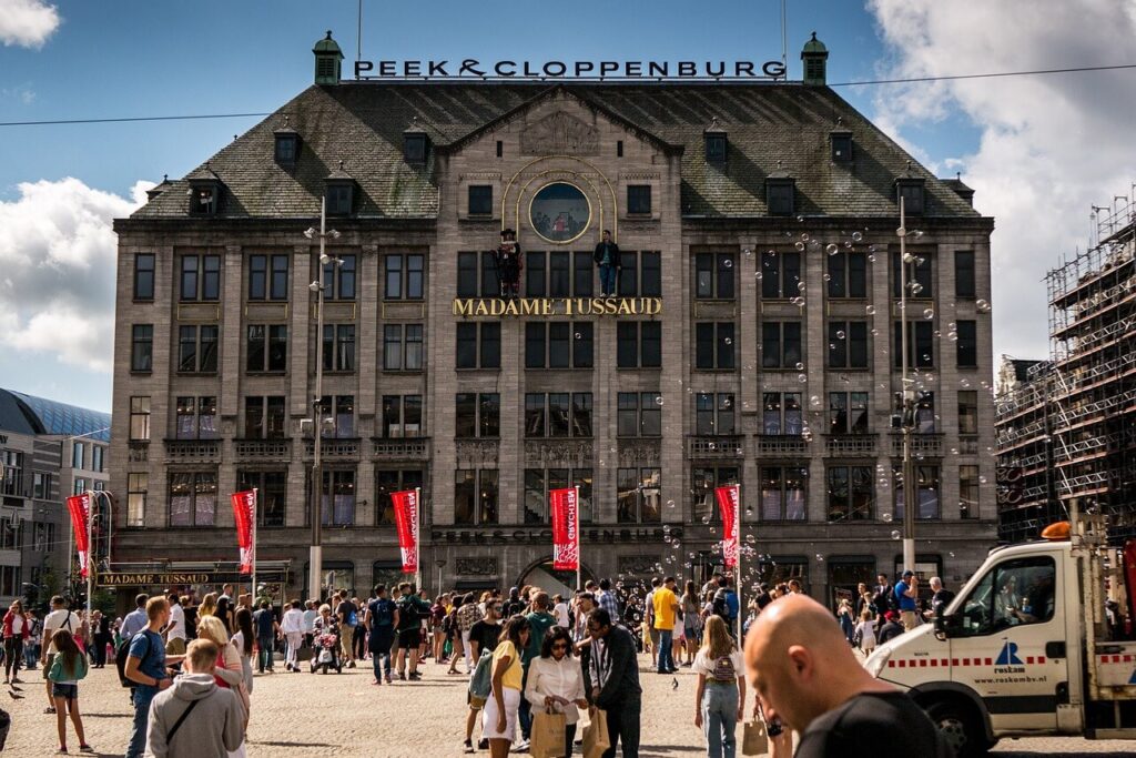 view of dam square and madame tussauds building in Amsterdam 