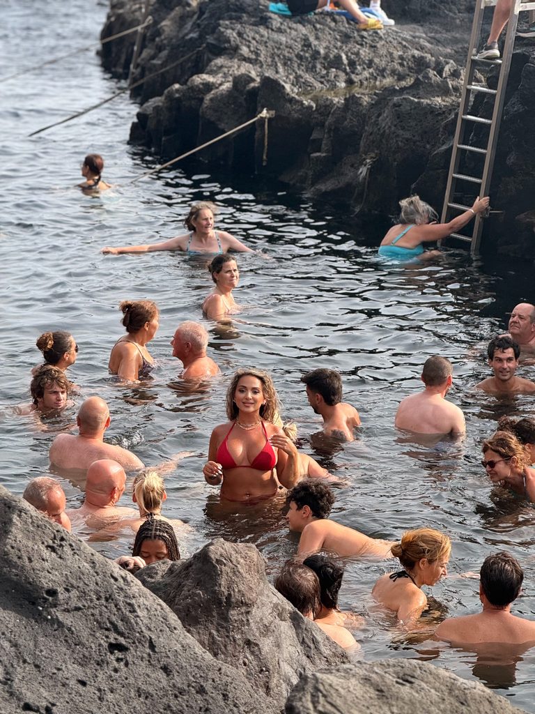 Bathing in the geothermal ocean pool at Ponta da Ferraria, São Miguel, Azores