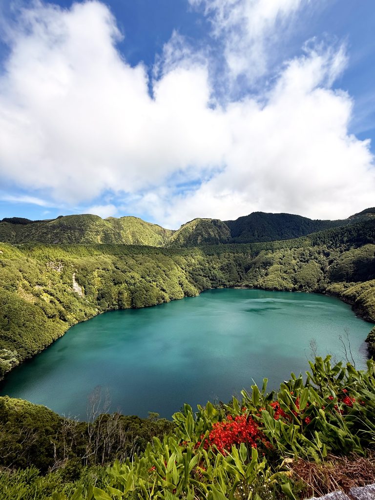 Emerald Lagoa de Santiago crater lake surrounded by forest in São Miguel, Azores