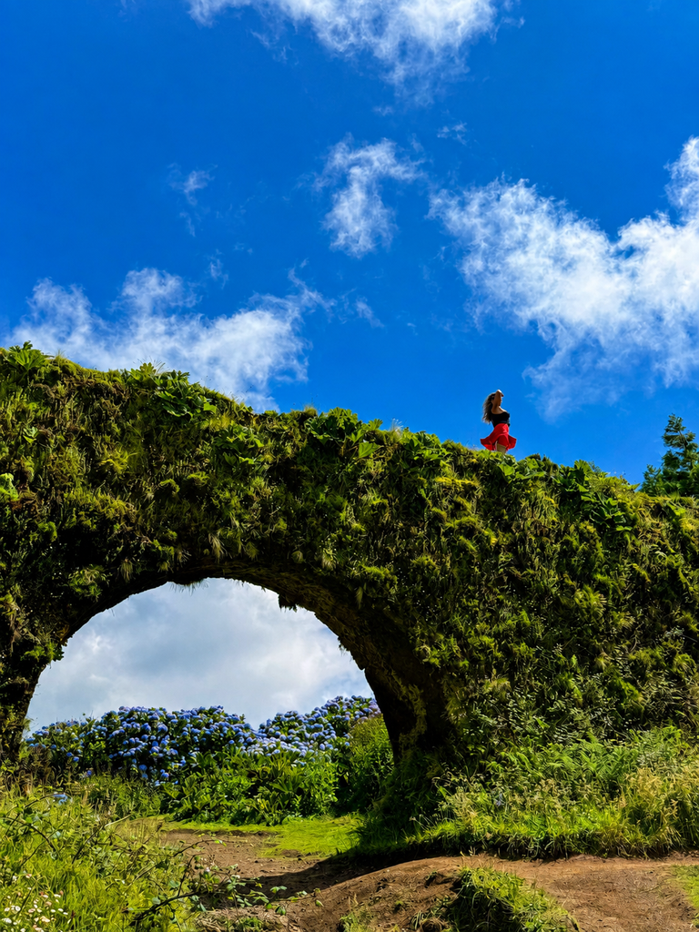 Moss-covered Muro das Nove Janelas aqueduct in São Miguel, Azores